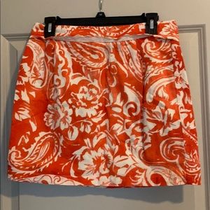 Orange patterned skirt with scalloped trim